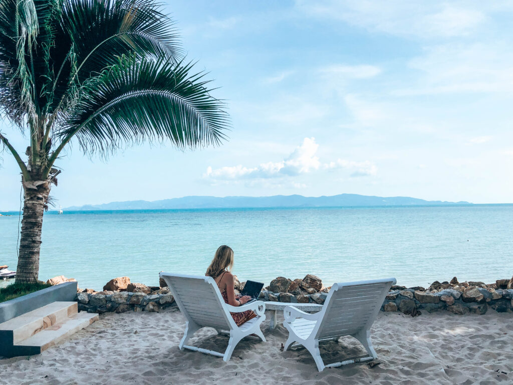 digital nomad jobs for beginners - working on the beach
